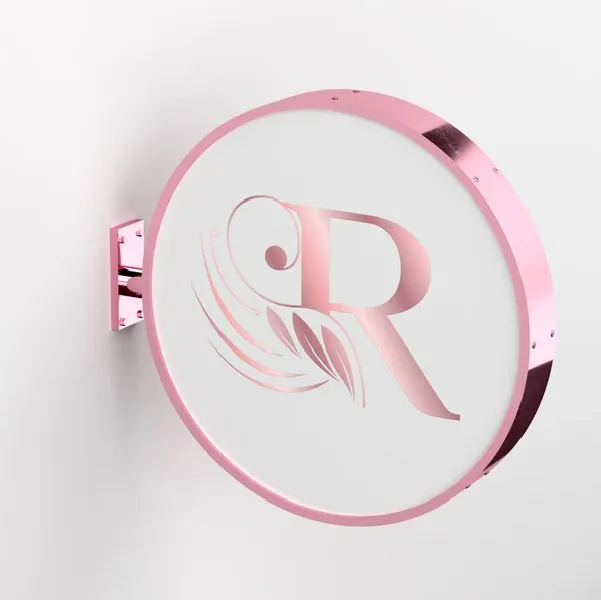 An image of Rosegold Lightbox Sign with logo hanging on a wall.