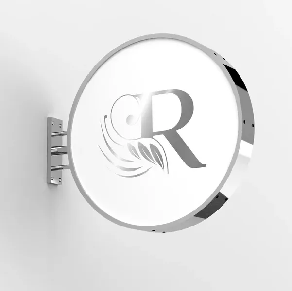 An image of Silver Lightbox Signs with logo hanging on a wall.