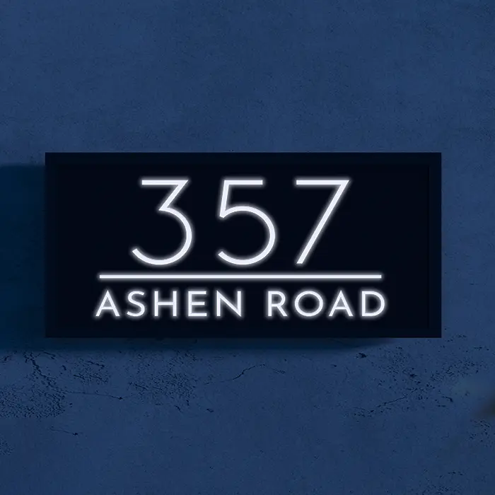 An image of the LED Address Sign product hanging on the wall. The image contains address information.